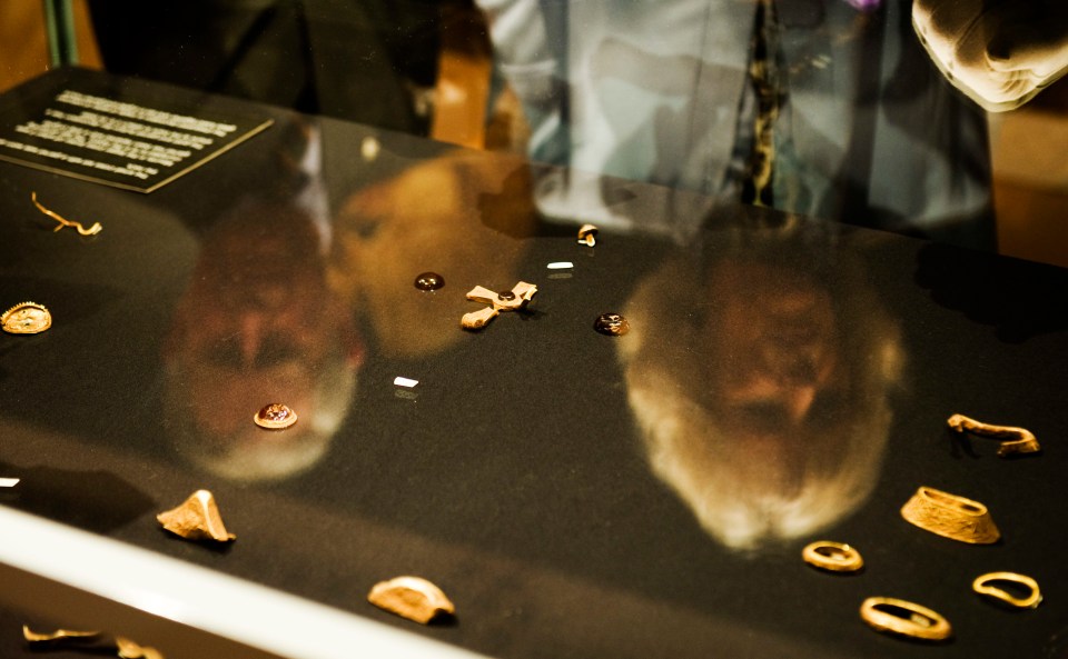 Prince Charles and the Duchess of Cornwall looking at some of the items found