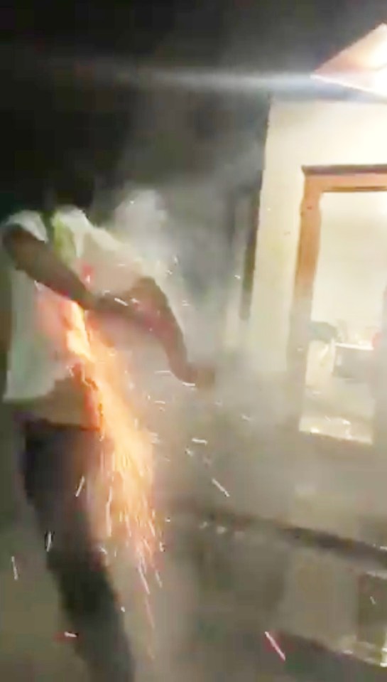 Fawking agony… the man’s t-shirt appears to catch fire