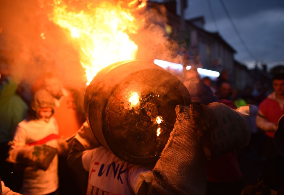  Tar barrels were seen bursting with flames as villagers cheered