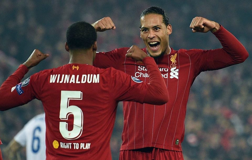  Liverpool's Dutch defender Virgil van Dijk helps scorer Georginio Wijnaldum celebrate his early breakthrough