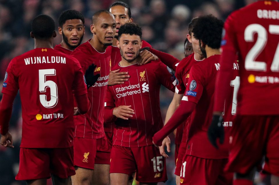  Liverpool mob Alex Oxlade-Chamberlain after he hits their winner early in the second period