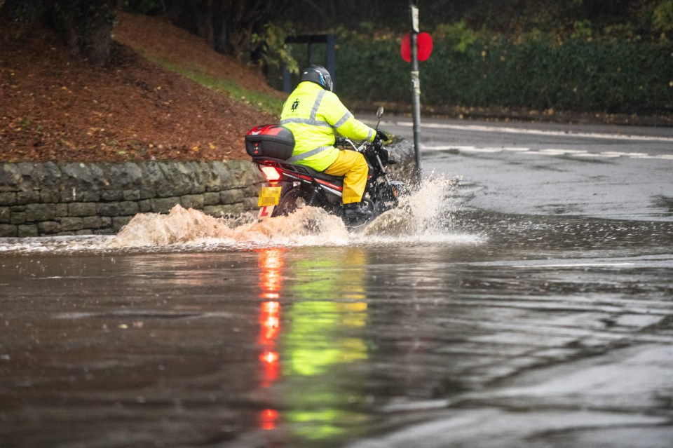  This motorcyclist was prepared for the floods near the Derbyshire village of Bubnell