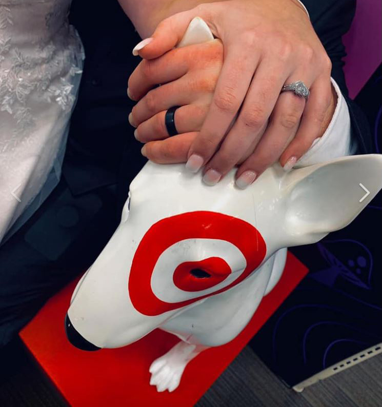  The bride and groom stopped for photos in the frozen food aisle and home section before photographing their rings on the Target dog