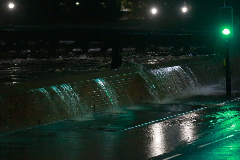  The River Don was pictured overflowing next to the Meadowhall shopping centre