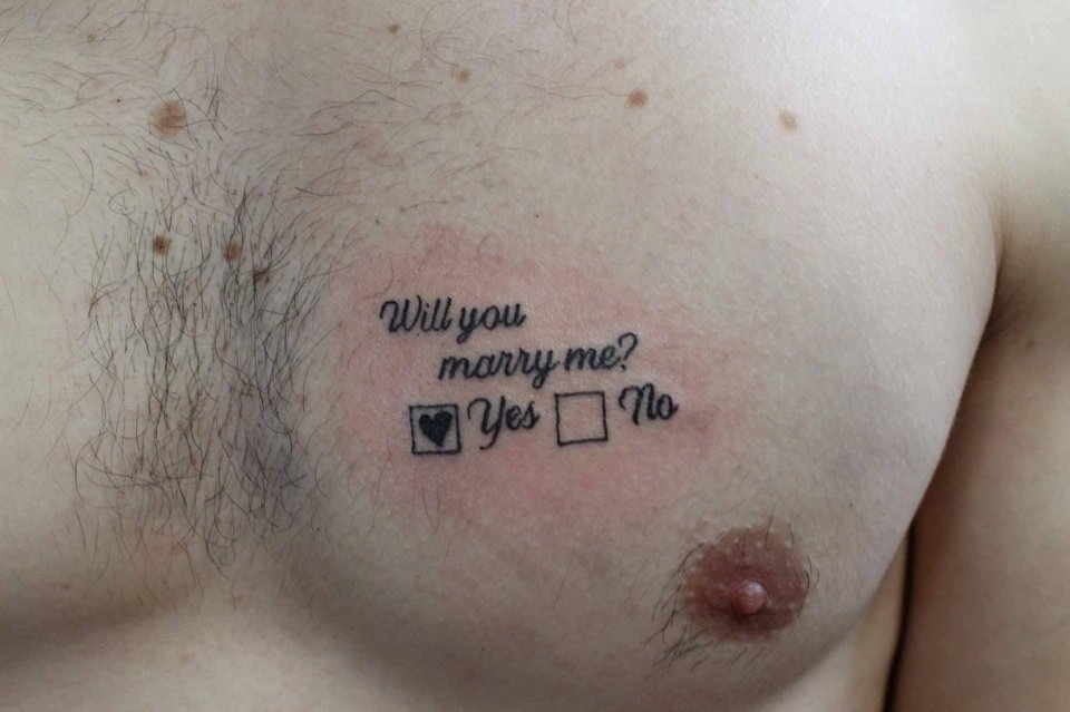  A man proposed to his girlfriend with a 'will you marry me?' chest tattoo