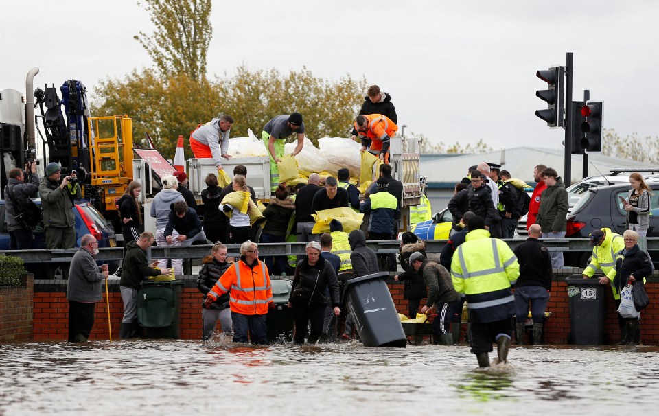  Locals battled flood waters with sandbags and barricades