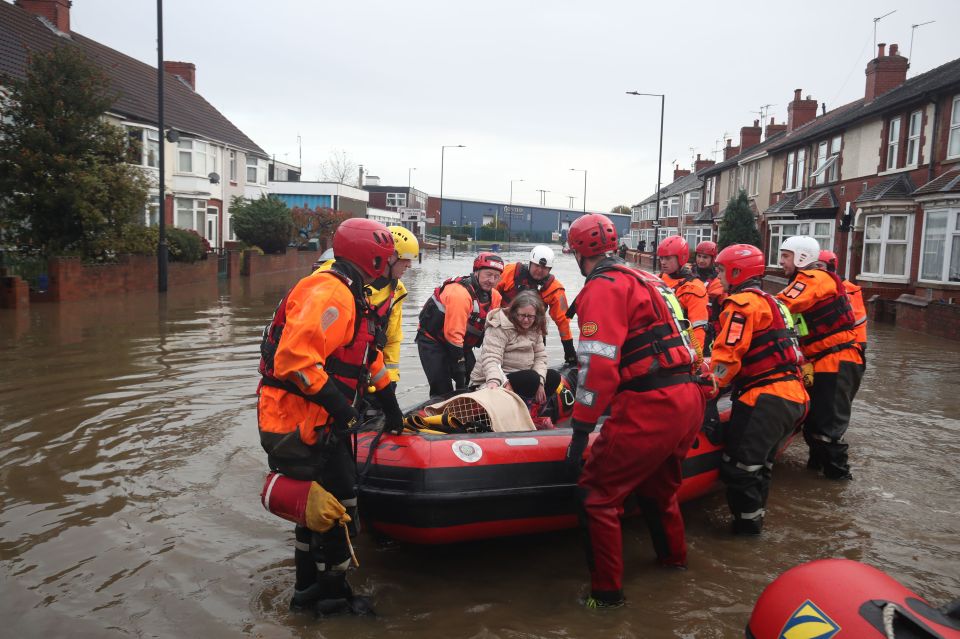  Inflatable boats were pulled down flooded streets to transport those in need