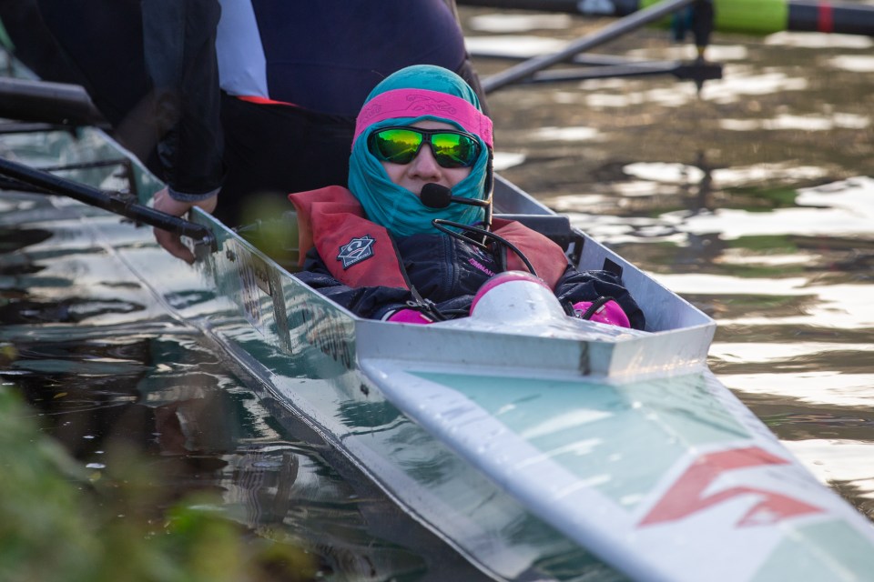  An early morning rower wraps up warm