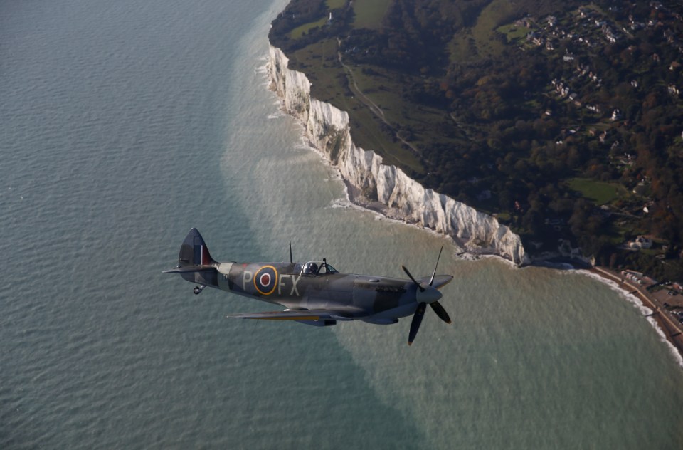  A World War II Spitfire, flies over the Battle of Britain Memorial in Folkestone, Kent, in a tribute to the fallen on Remembrance Day