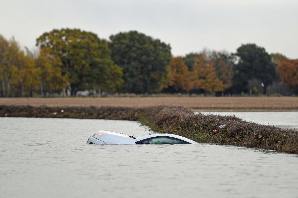  A car floating in the water on the outskirts of Fishlake, Doncaster, as parts of England endured a month's worth of rain in 24 hours