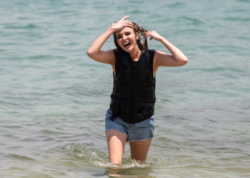 A drenched Nadine was still all smiles as she made it to shore