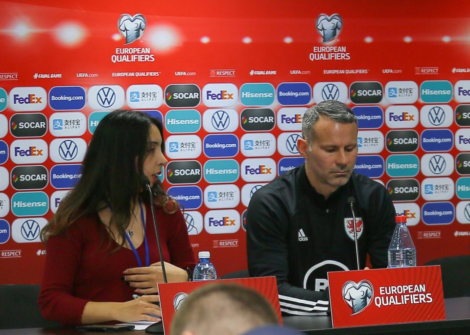  The translator sits next to Giggs, who doesn't look impressed, before getting the elbow