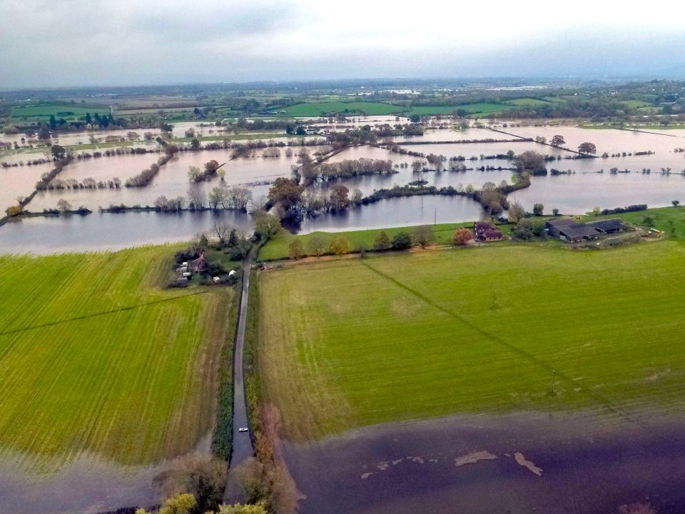  A flooded road and fields near Forthampton, close to Tewkesbury