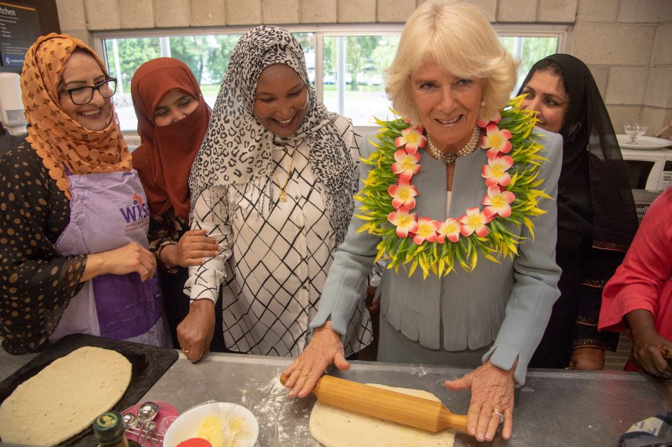  The Duchess of Cornwall gives the rolling pin a go during the royal visit