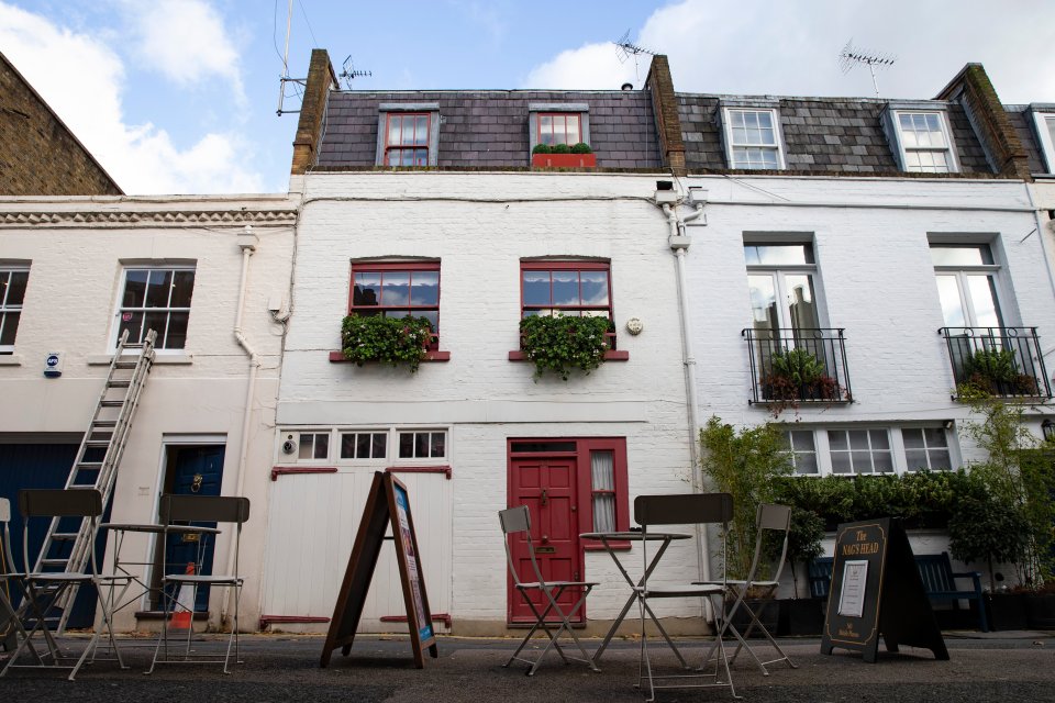  Maxwell is thought to still own this mews house, with a red front door, in central London