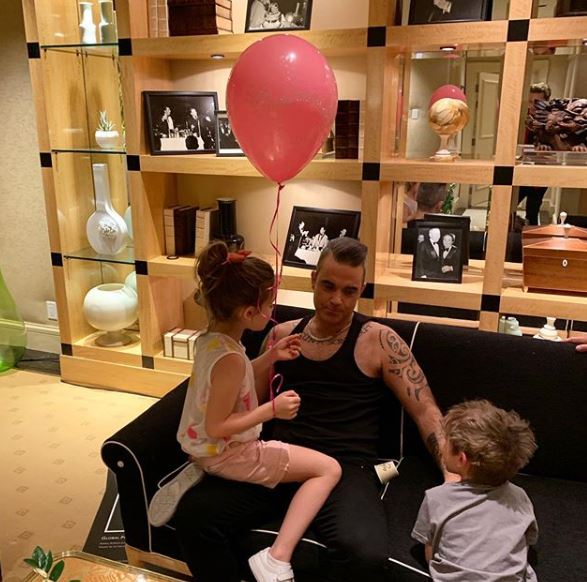 Robbie pictured with daughter Teddy and son Charlie, right