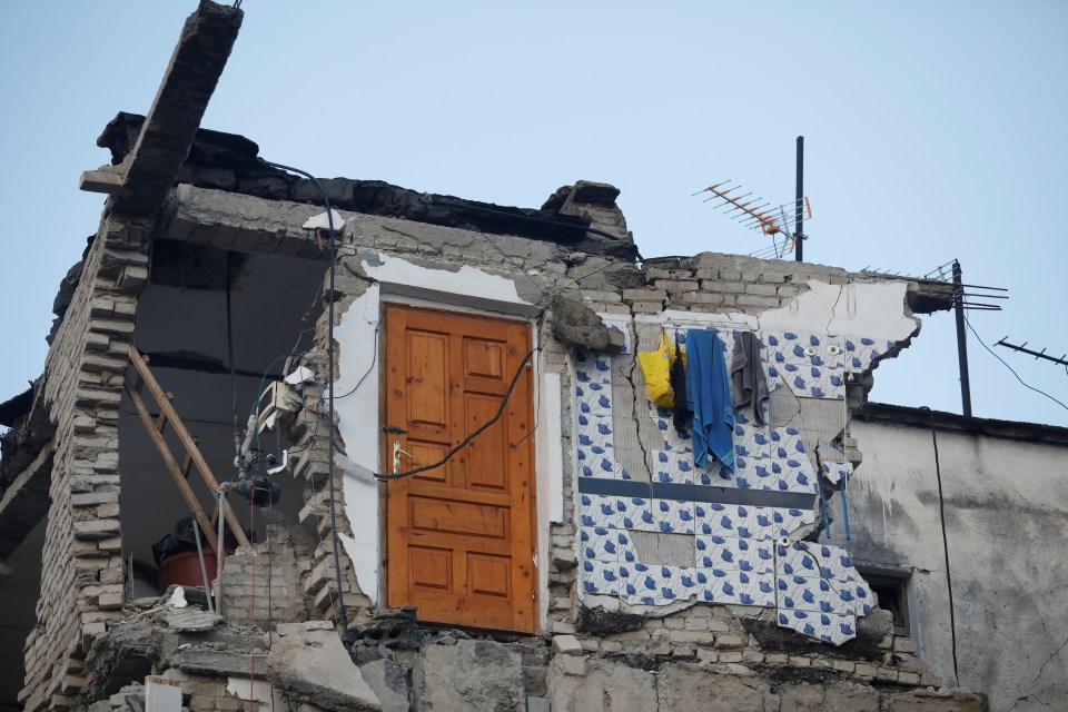  An interior door is exposed by the fall of a house in Thumane, Albania