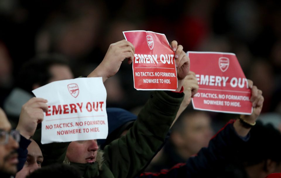  Arsenal fans held up 'Emery Out' signs after the Gunners fell behind to Eintracht Frankfurt