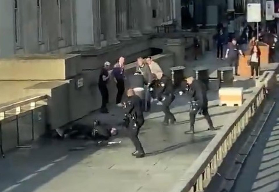  Armed police can be seen with their guns trained on the suspect on London Bridge