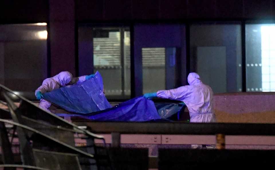 Police forensic officers work where a man was killed on London Bridge on Friday, November 29