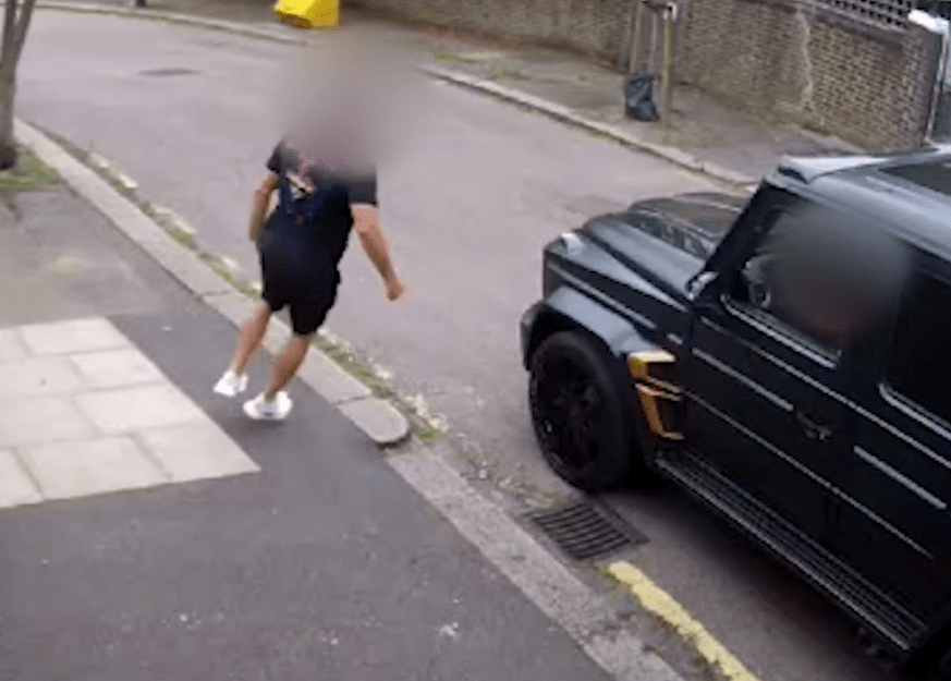  The robbers ran around the car as the footballer confronted them