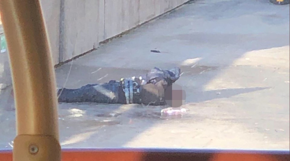 The suspect appears to be wearing the fake suicide belt after 12 people were injured at London Bridge today