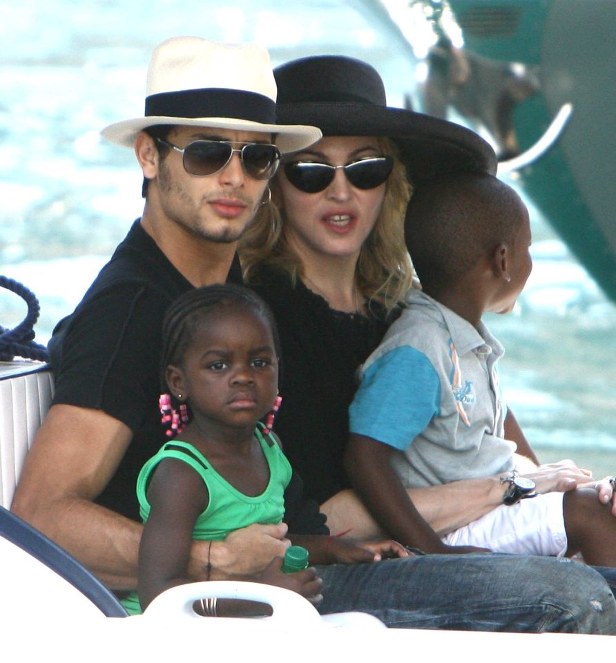  Madonna takes a boat trip with Jesus and two of her kids, Mercy and David, in Italy the same year