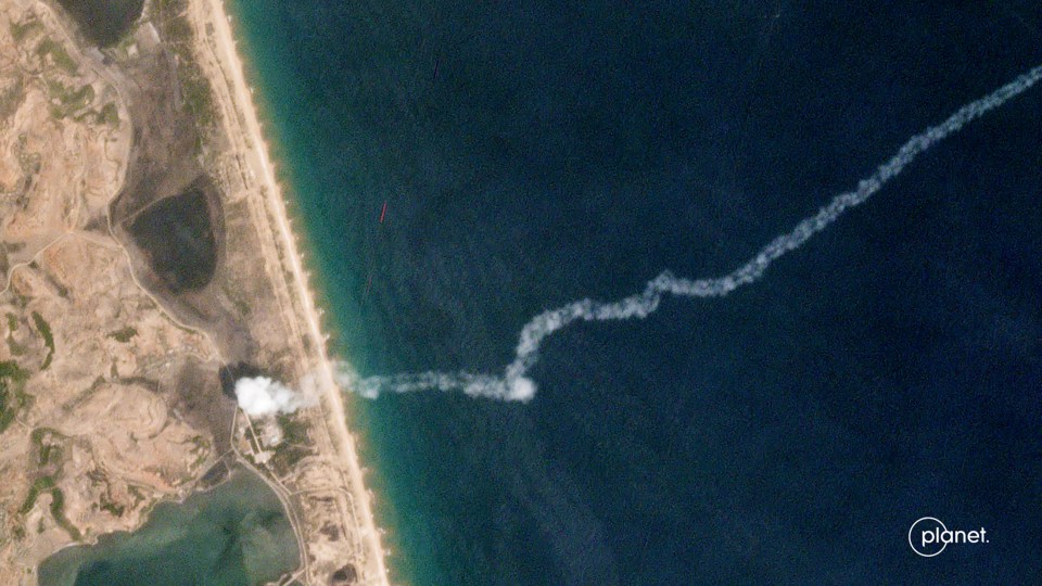  The trail of a suspected missile is seen on a commercial satellite image taken over the Hodo Peninsula in North Korea.