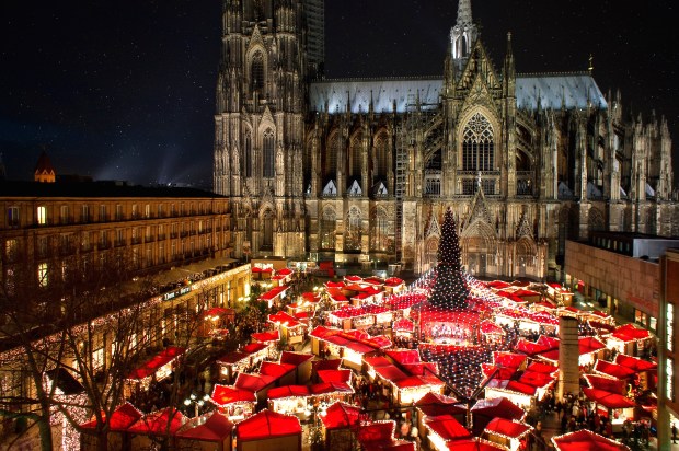 a christmas market in front of the cologne cathedral