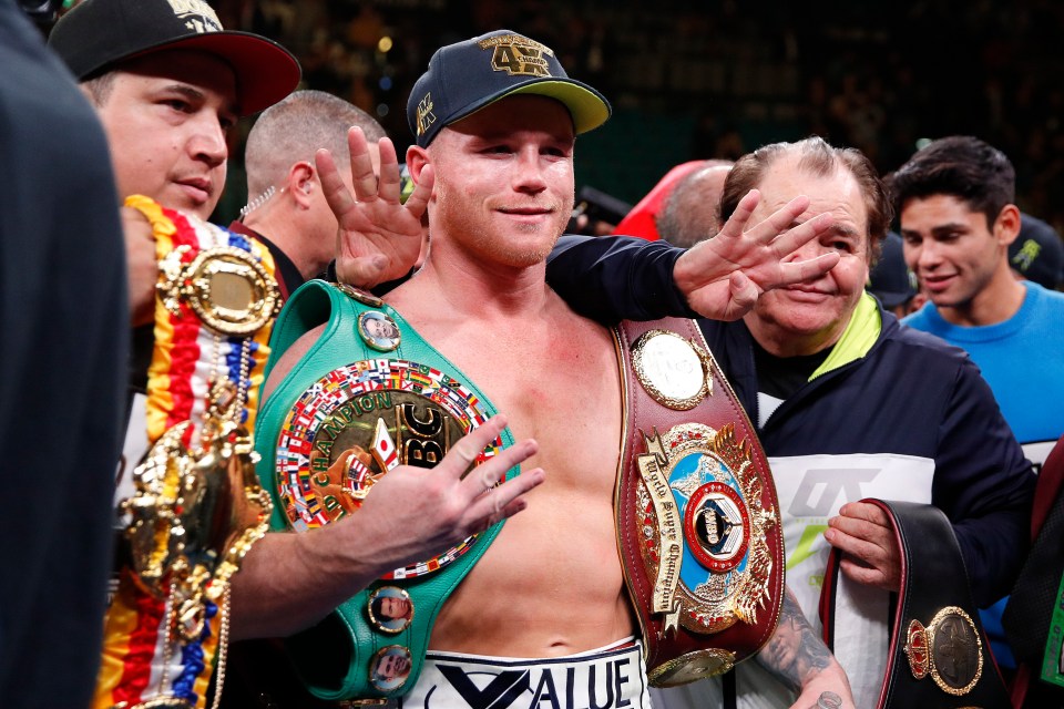  Canelo Alvarez posed with his belts after his win over Sergey Kovalev