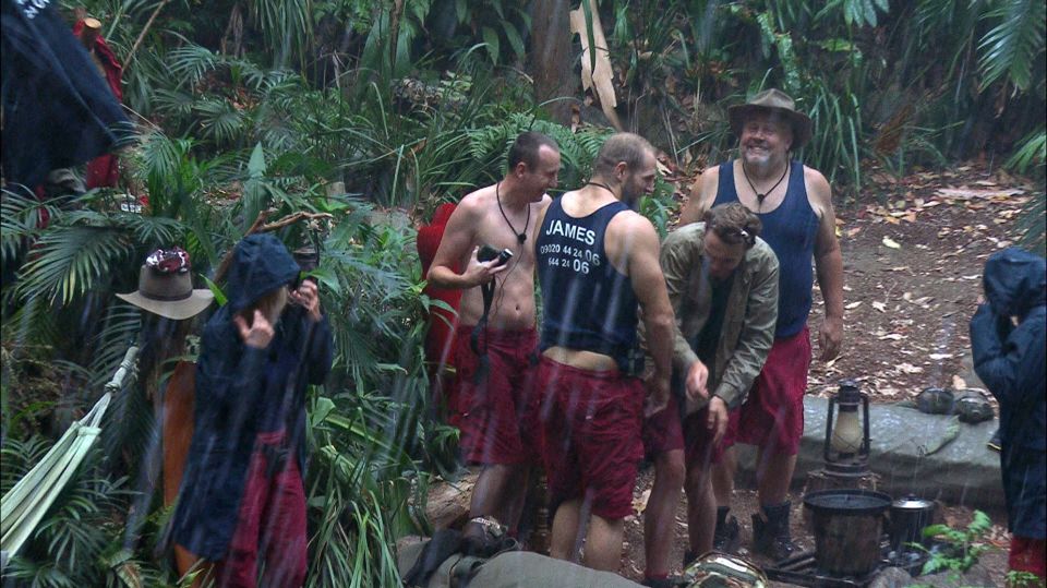  The celebs run for cover after it starts pouring in the jungle