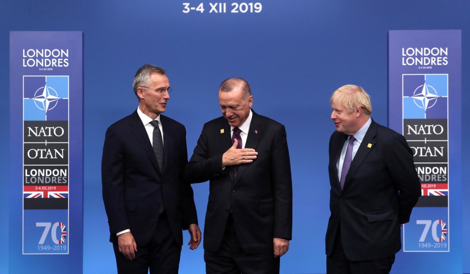  President Recep Tayyip Erdogan of Turkey stands onstage with Boris Johnson and the Secretary General of NATO Jens Stoltenberg