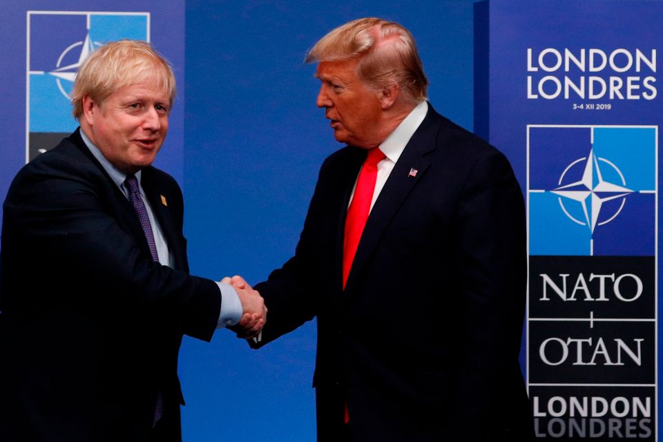  Boris Johnson and Donald Trump shake hands at the Nato summit