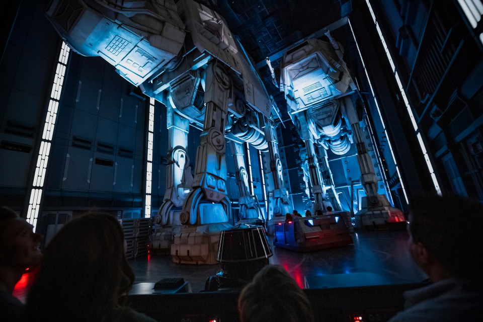  Guests race past massive AT-AT walkers aboard a First Order Star Destroyer