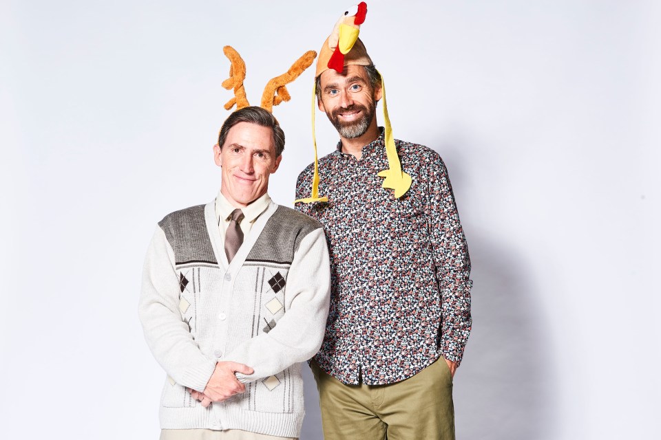 Rob Brydon and Rob Wilfort wearing novelty headwear.