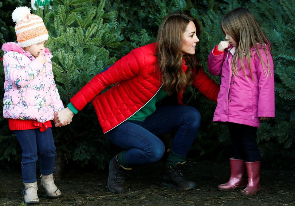 The mum bends down to speak to some of the youngest visitors