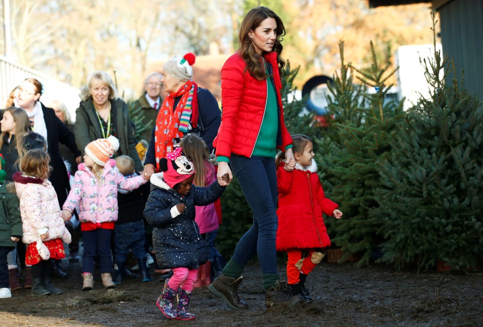 The mother was followed outside by a bunch of excited children