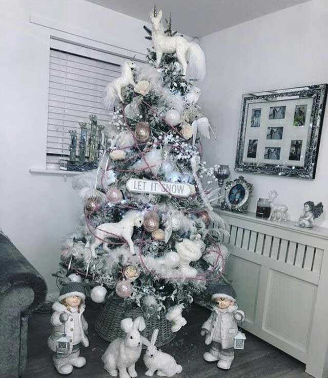 This person has added unicorns, signs, and even bunnies on and around their tree