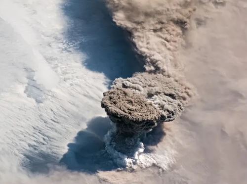  A plume of ash and gases rises from the erupting Raikoke Volcano on the Kuril Islands in the North Pacific in June, 2019