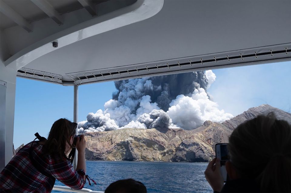  A group watch the eruption from a boat