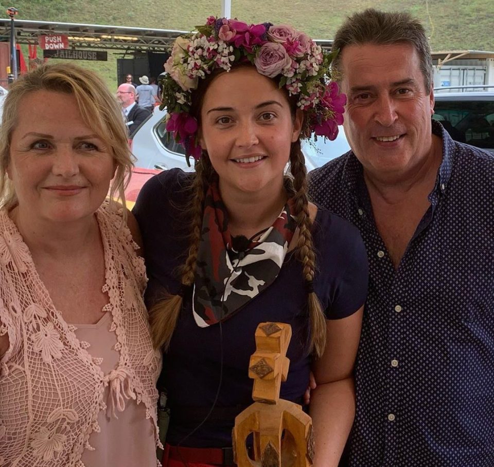  Jacqueline poses with her mum and dad John following her jungle win