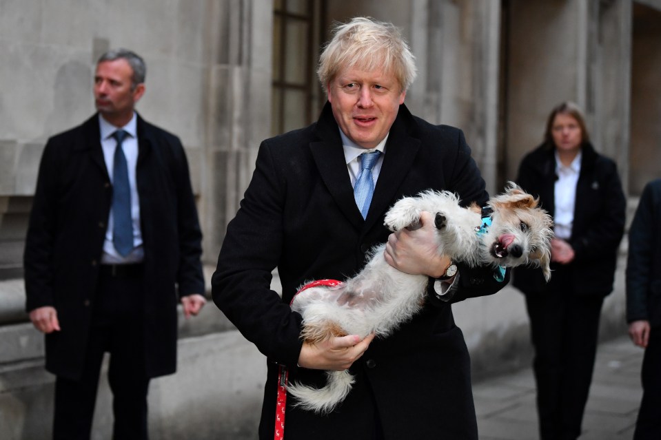  Boris Johnson leaves a polling station at the Methodist Central Hall with his dog Dilyn