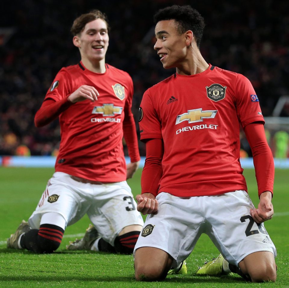  Man Utd striker Mason Greenwood celebrates his quickfire double with fellow 18-year-old James Garner