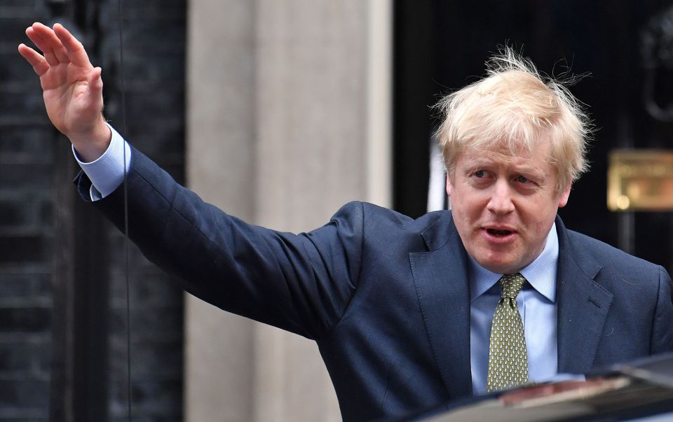  The newly elected PM waves ecstatically from Downing Street