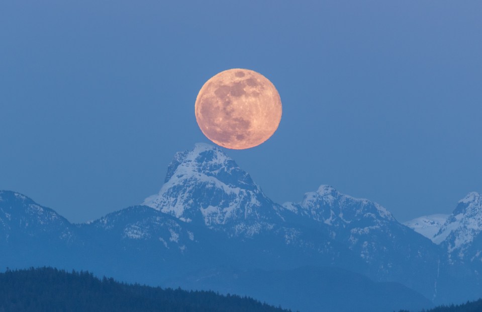  A supermoon rising on 2019's spring equinox on Quadra Island, British Columbia, Canada, is captured here by photographer Dr Loren Merrill