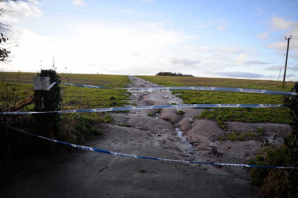  Forensic officers are combing woodland for clues after a body was found near a leafy Trafford village