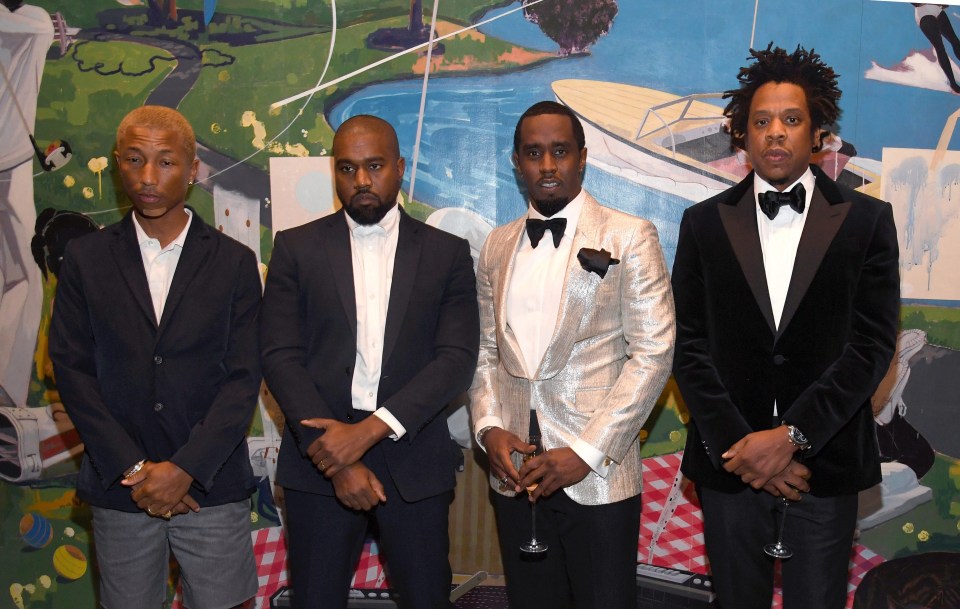 Pharrell Williams, left, also joined the rappers to celebrate P Diddy’s big day