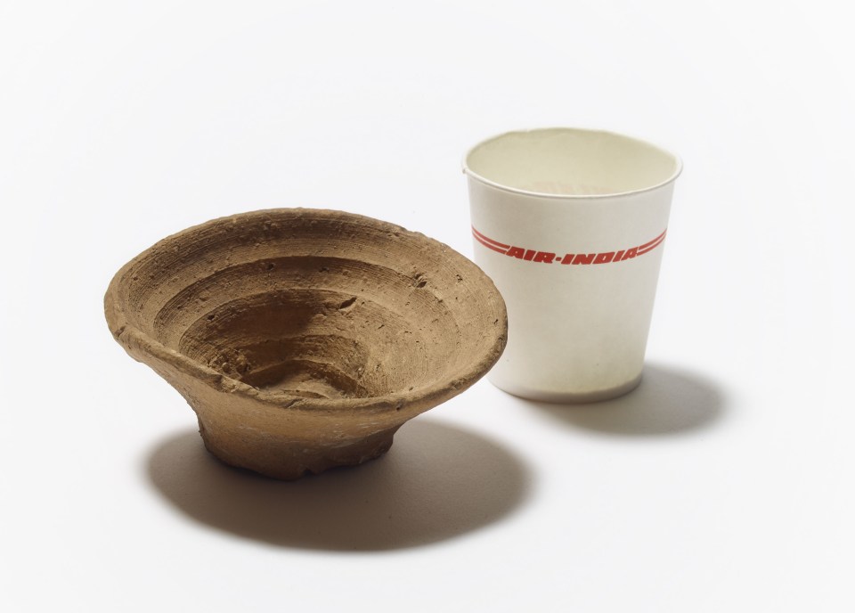  The 3,500 year-old single-use cup placed next to an Air-India disposable cup