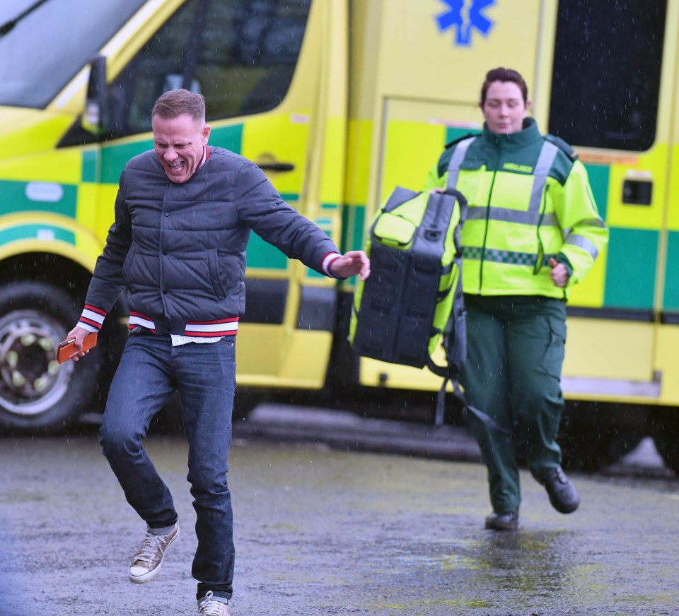 Sean leads the paramedics to the emergency in Coronation Street