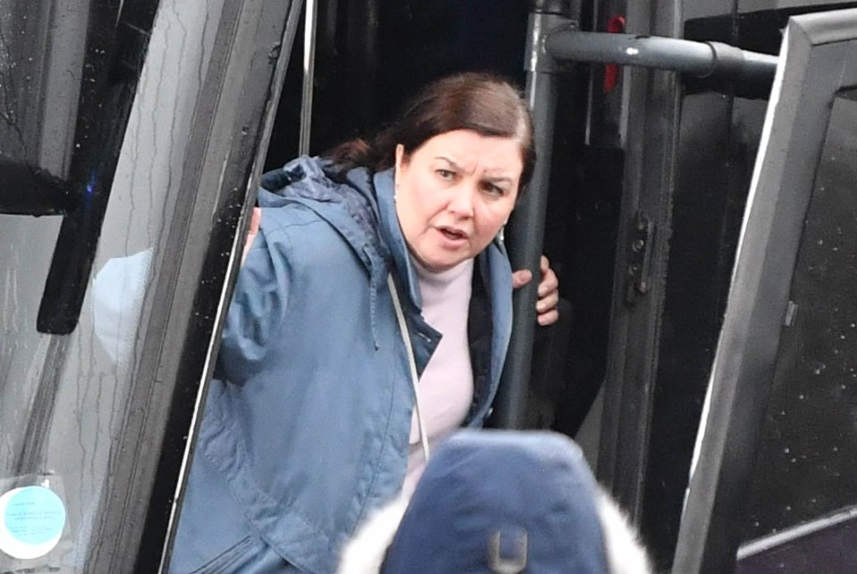 An injured Mary leans out of the party bus in Coronation Street